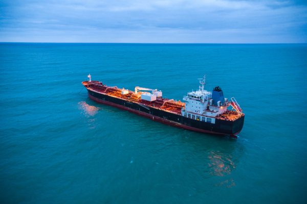 Aerial top view oil ship tanker carrier oil on the sea at sunrise
